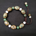 Green agate ethnic bracelet with three eye Tibet beads in hand-woven geometric pattern