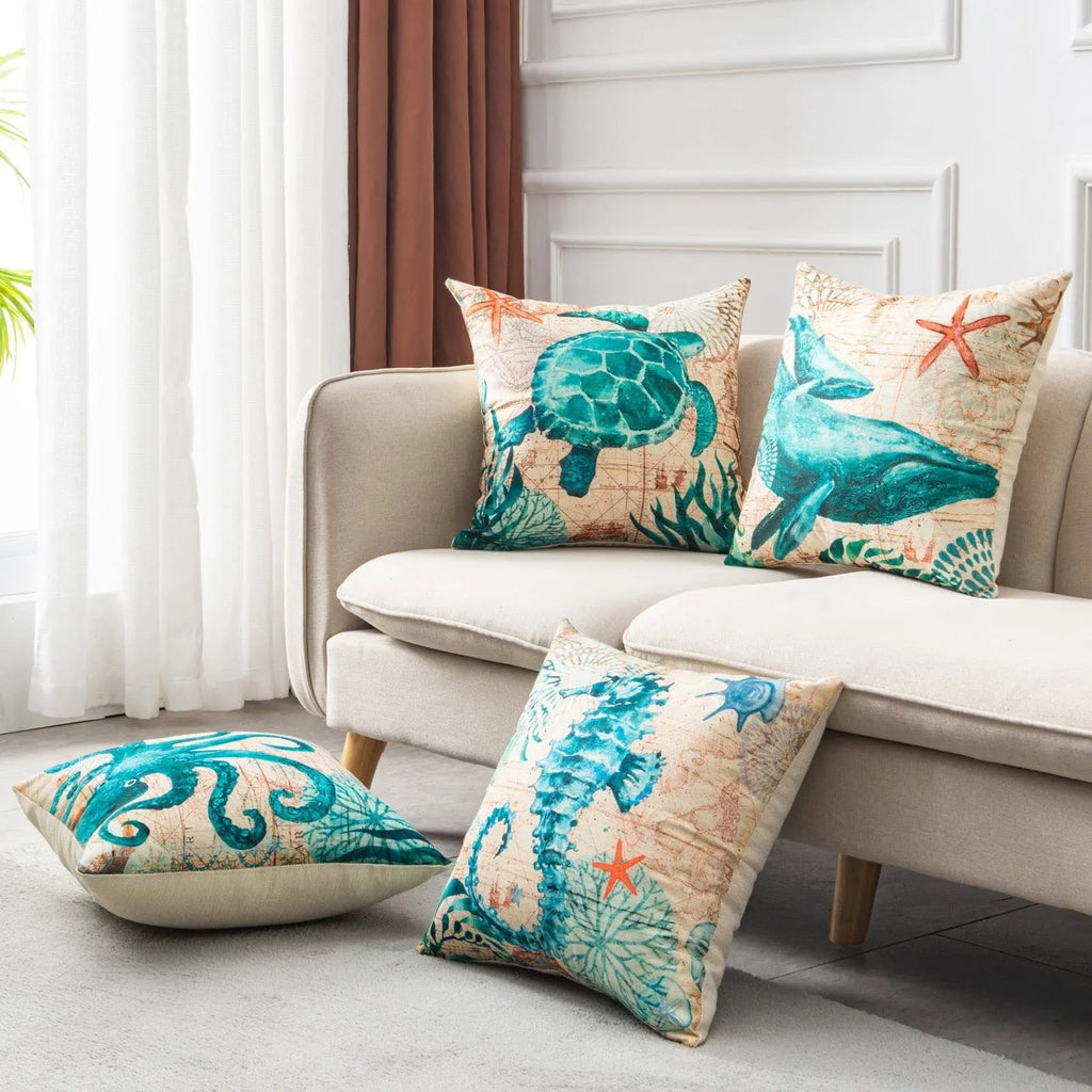Linen cushion cover with detailed sea turtle print, measuring 45x45cm, on a sofa.
