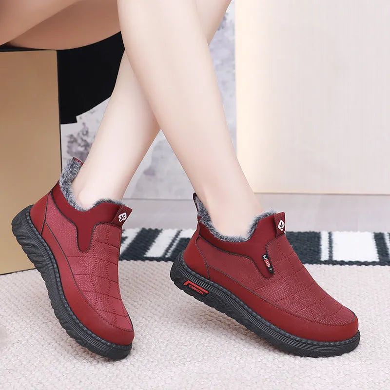 Women's black casual flat ankle boots with a synthetic leather upper and rubber sole.