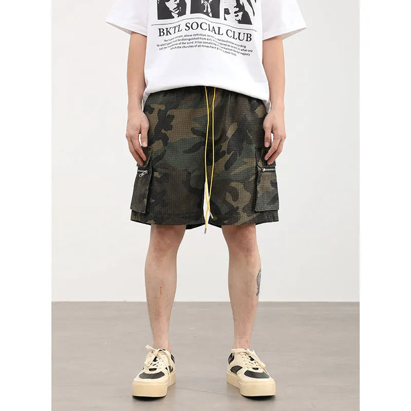 Men's camouflage pattern multi-pocket work shorts in a cropped length.