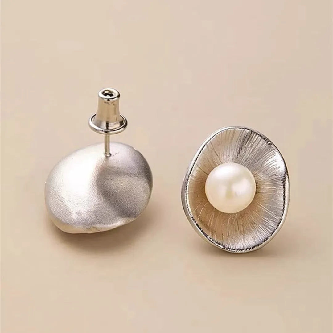 Sterling silver needle earrings with geometric design and pearl accents in gold electroplated finish
