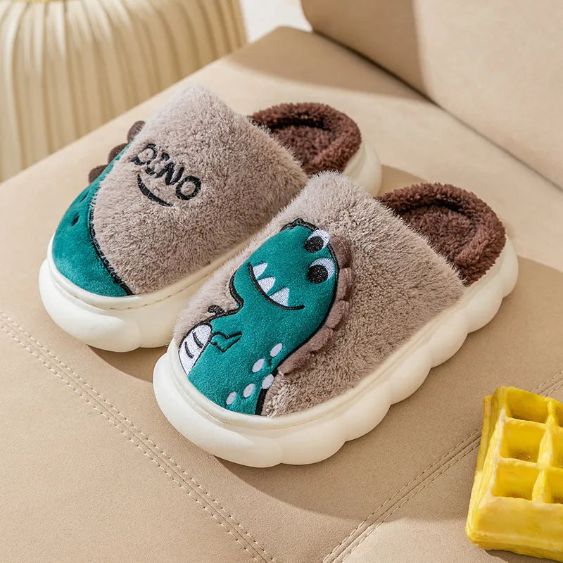 A pair of plush cotton couple slippers in a dinosaur colour design, showing thickened soles.