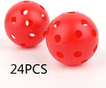 Multi-colour golf practice balls with 26 holes on a green surface.