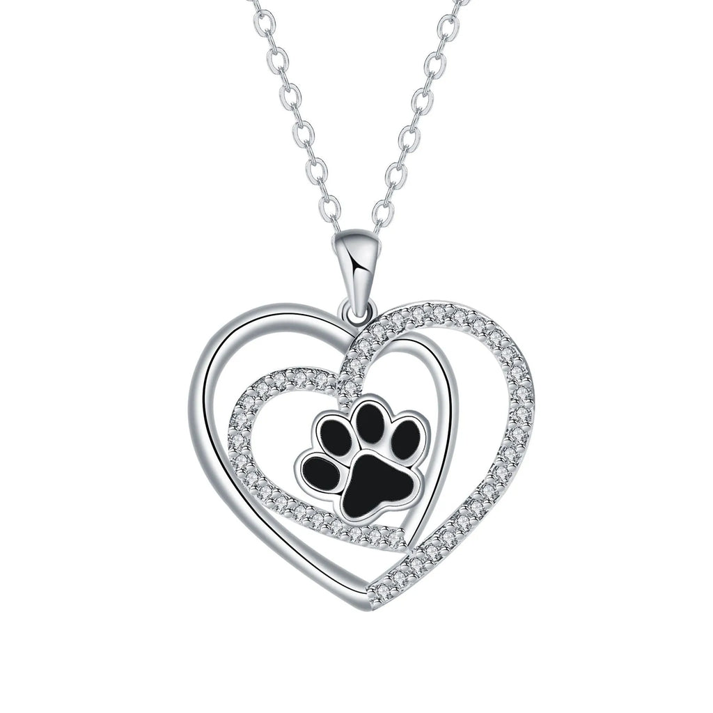 Women's copper dog paw print heart necklace on a cross chain.