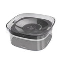Large transparent pet water bowl with floating slow-feeder disk inside.