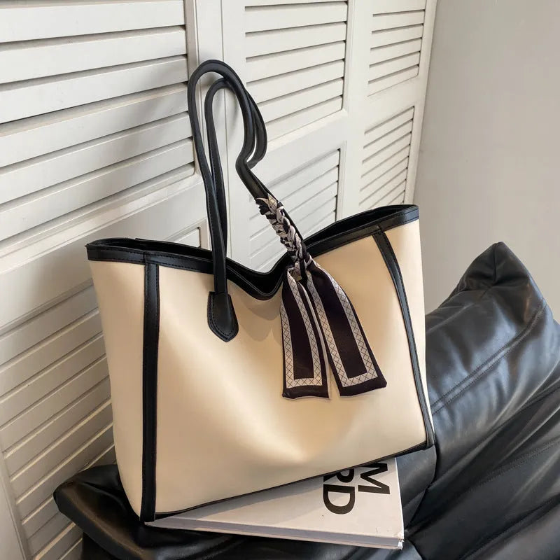 Soft PU leather commuter tote bag showing open outer pockets and horizontal square design