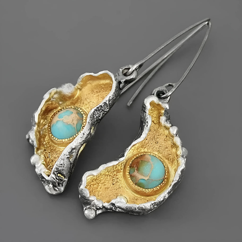 Ear-shaped women's earrings in alloy with a two-tone oil-painted geometric finish, shown as a pair