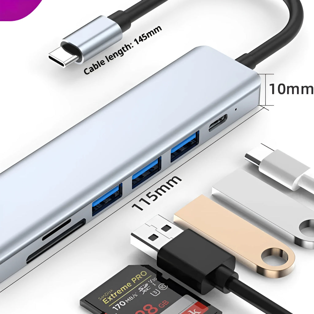 Silver seven-port type-C USB expander hub with a short black cable on a wooden desk.