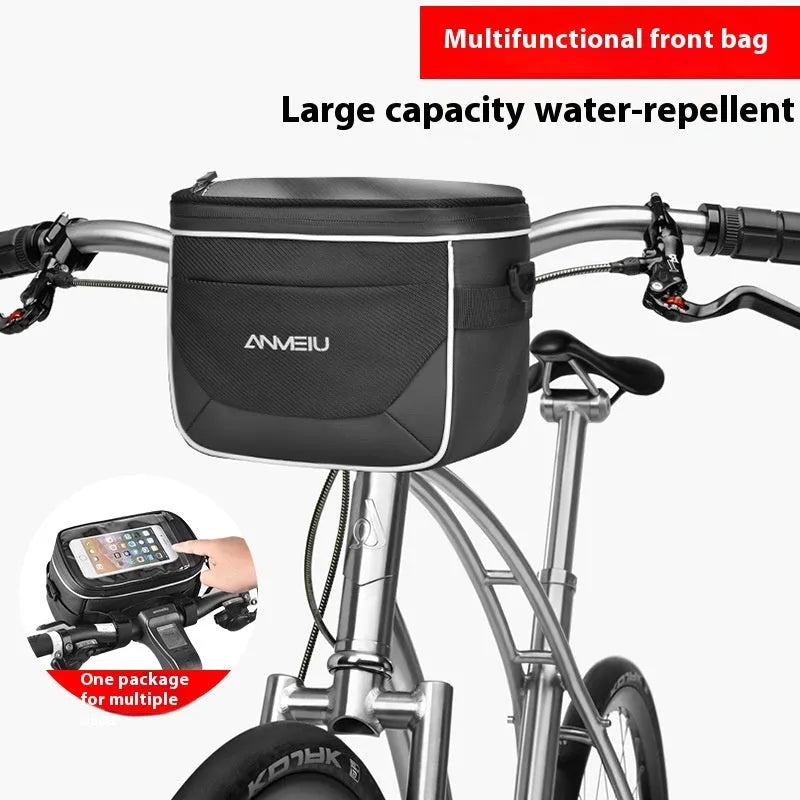 Black folding bicycle bag with hanging strap attached to handlebars