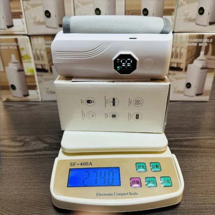 Grey and white portable car charger electric milk warmer for baby bottles.
