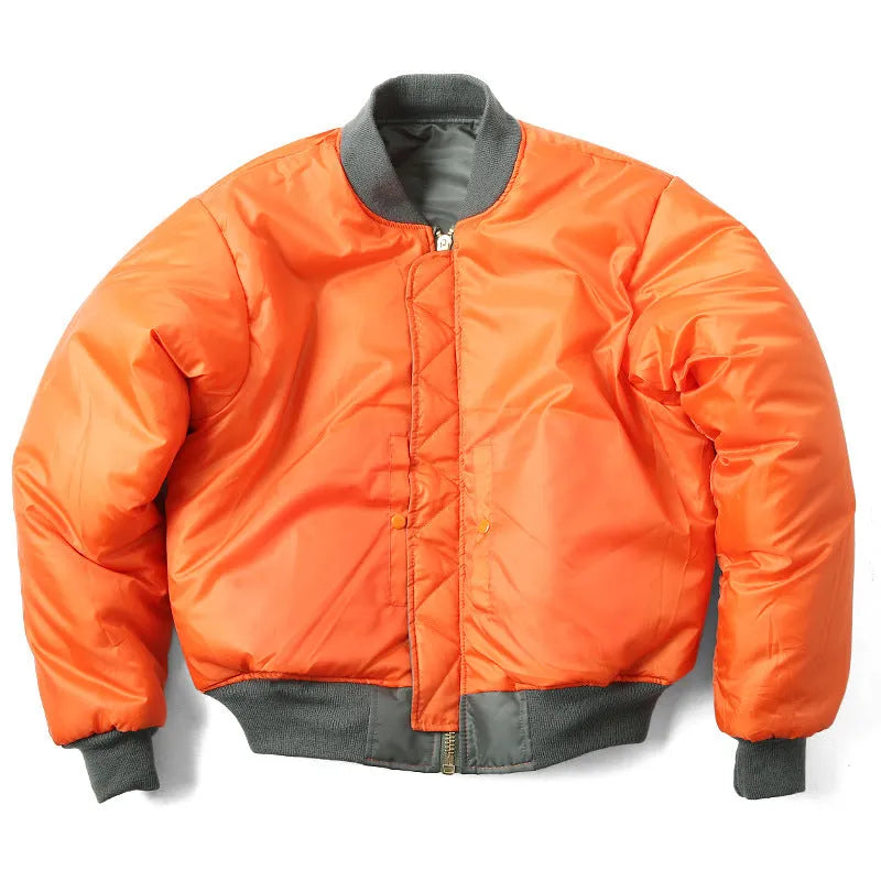 Man wearing a loose-fit army green nylon pilot jacket with a double-sided, wear-resistant construction.