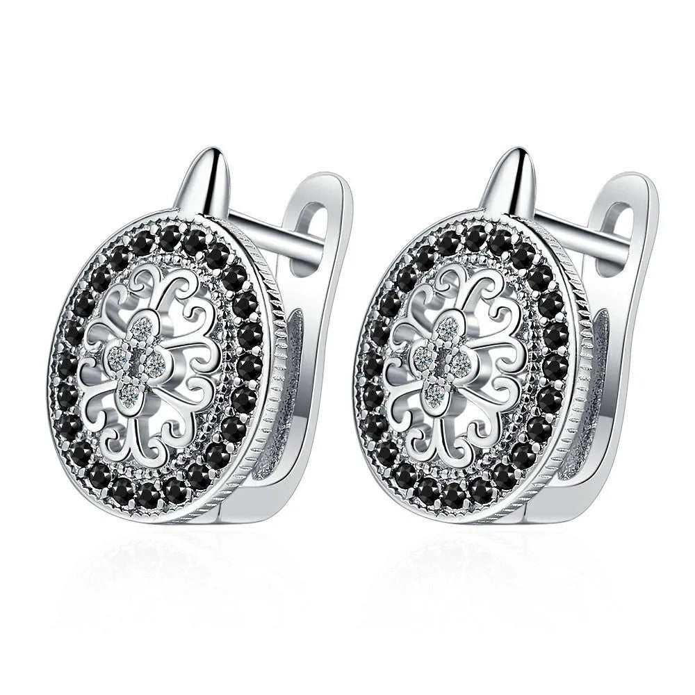 Pair of round diamond-encrusted ear clip earrings in copper white gold plated platinum colour