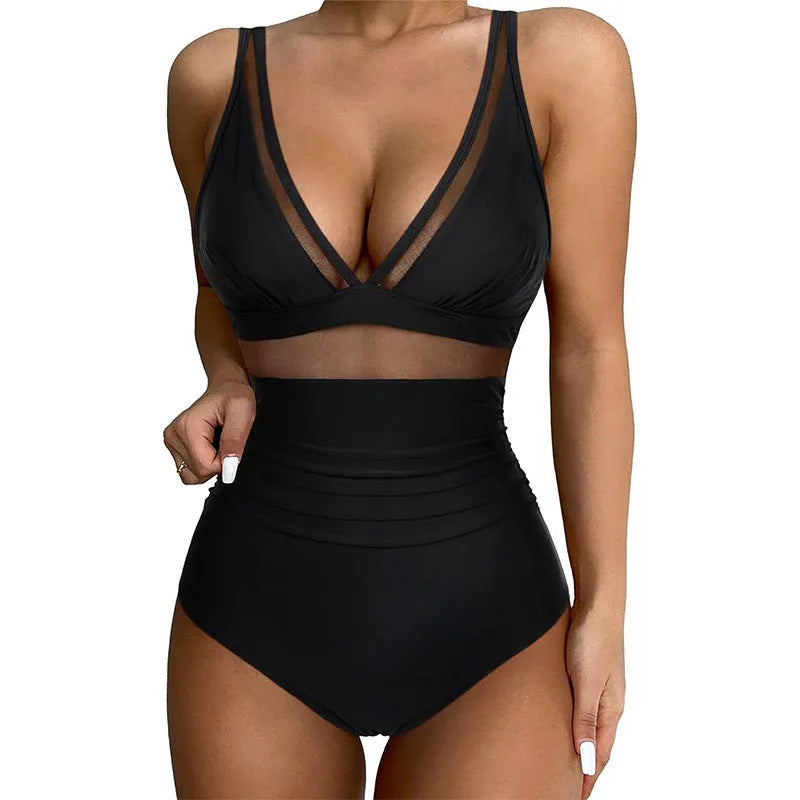 Black women's halter-neck one-piece swimsuit with mesh colour-block panels on mannequin.