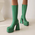 Women's casual boots in artificial PU leather available in black, red, blue, and white colours