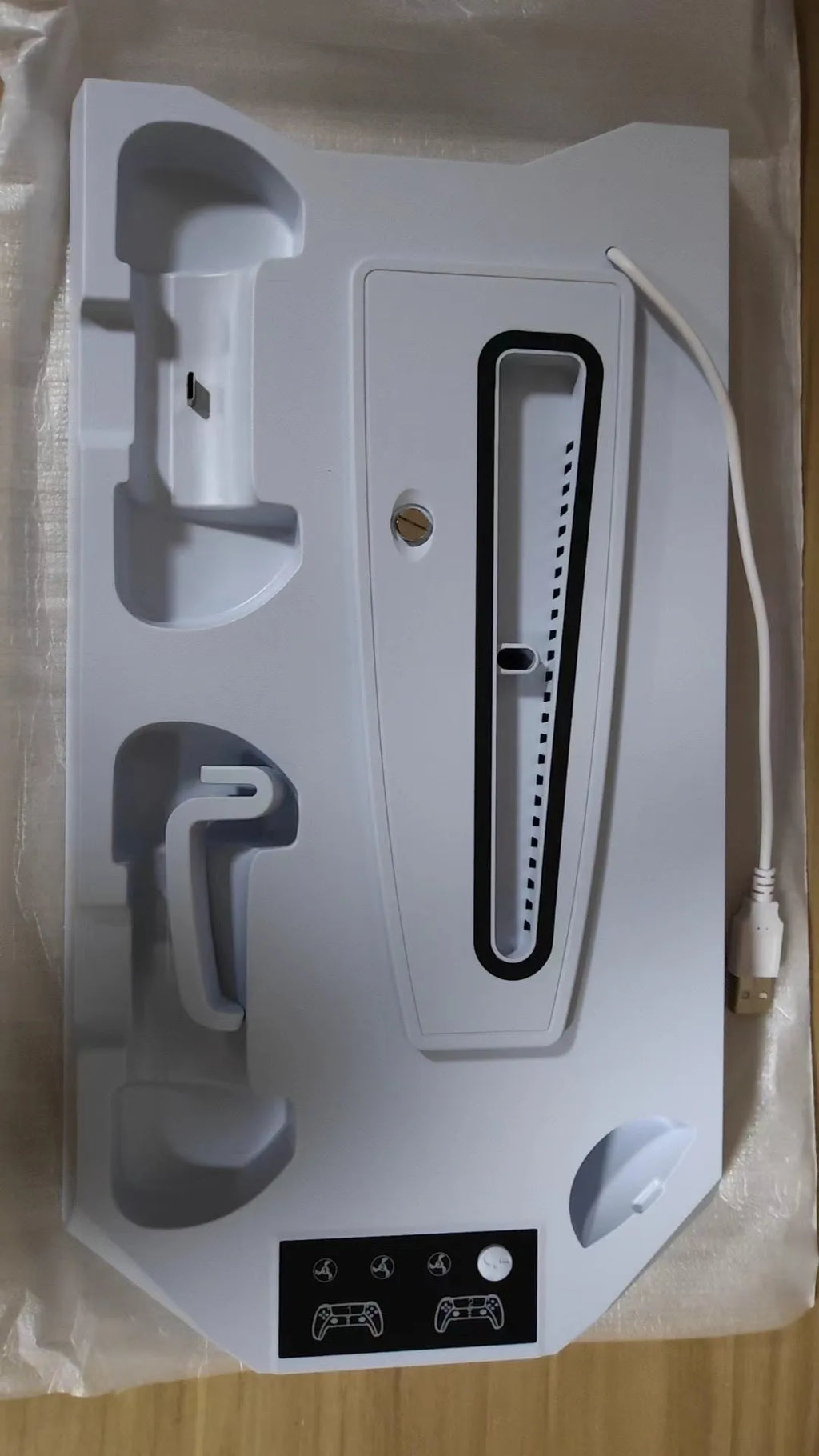 PS5 charging station with direct USB plug, heat dissipation base, and accessory storage in black or white