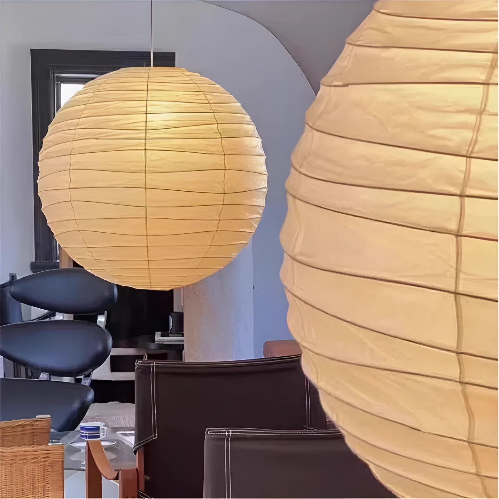 Japanese style rice paper ceiling chandelier light fixture in a living room setting.