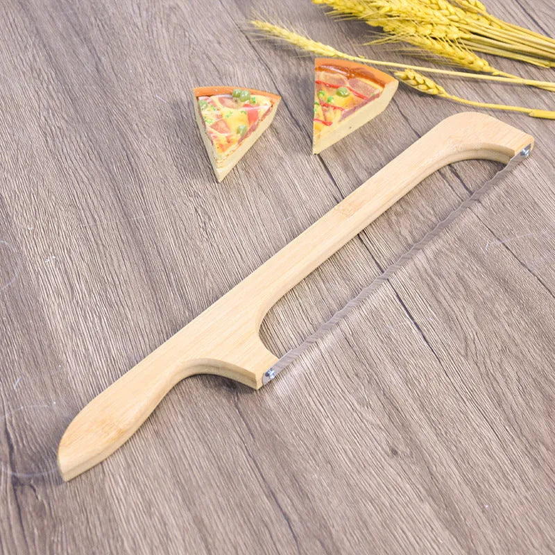 Wooden serrated bread knife with 40cm blade on a cutting board next to a loaf of bread