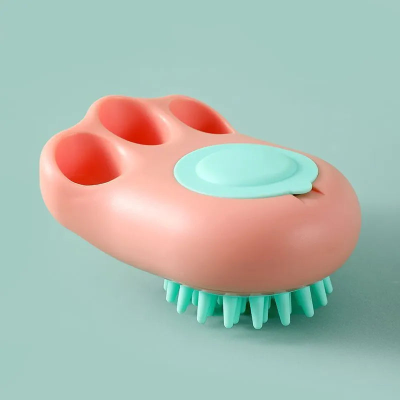 Blue silicone claw-shaped pet bath brush with flexible bristles for washing cats and dogs.