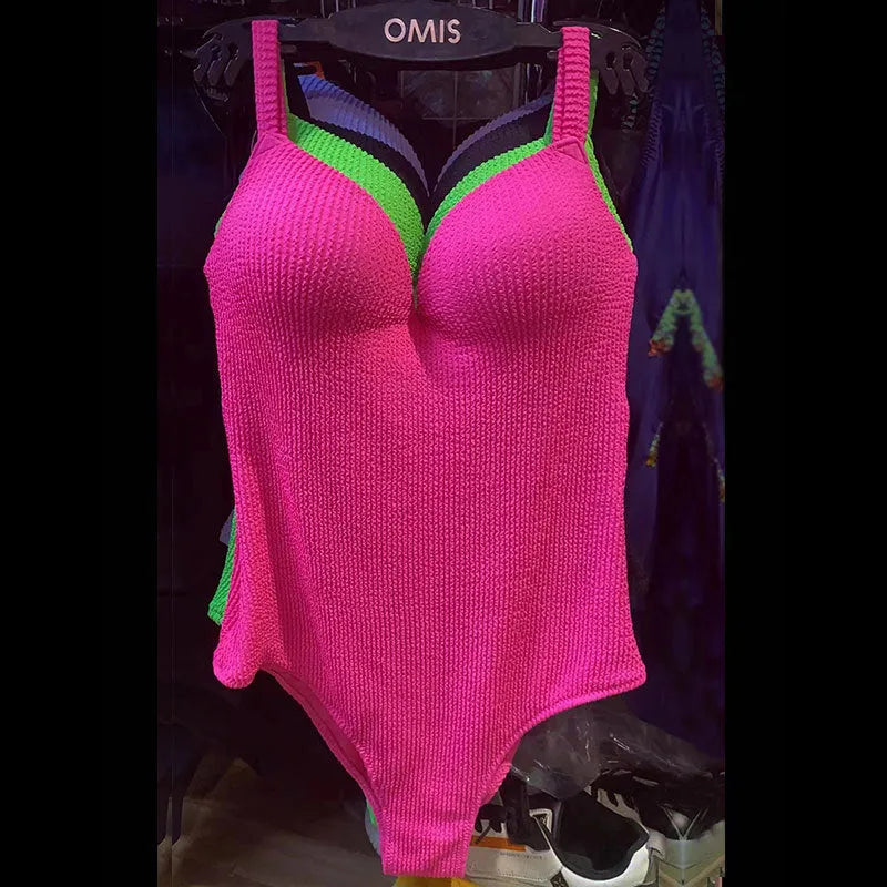 Women's sleeveless one-piece swimsuit in a small sunken stripe pattern, shown in multiple colours.