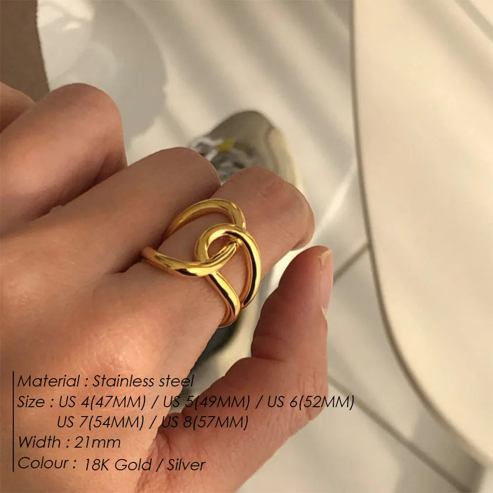 Geometric U-shaped adjustable ring for women with a knotted detail, shown in stainless steel gold tone finish.