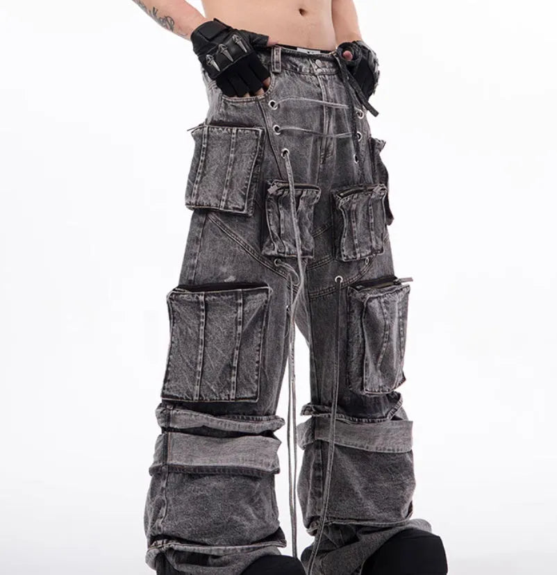 Grey distressed denim mop pants overalls with rope stitching detail on a hanger