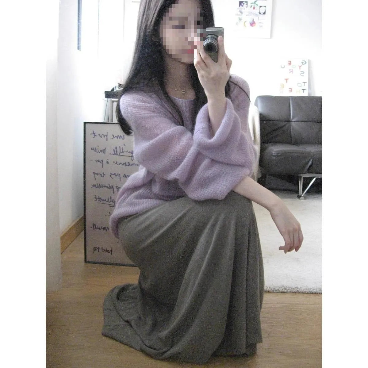 Purple women's sleeveless sweater with hollow-out design and shoulder strap detail.