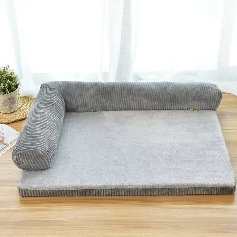 Corduroy bolster dog bed in grey colour, showing its non-slip base and high sides.