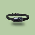 Black wifi camera neckband recorder on a table showing compact size and Type-C port