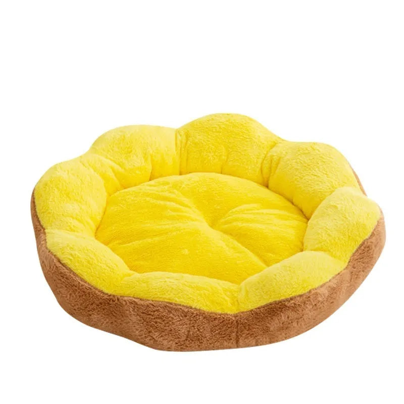 Round grey and black plush cat bed with a raised rim and a removable inner nest, shown on a wooden floor.