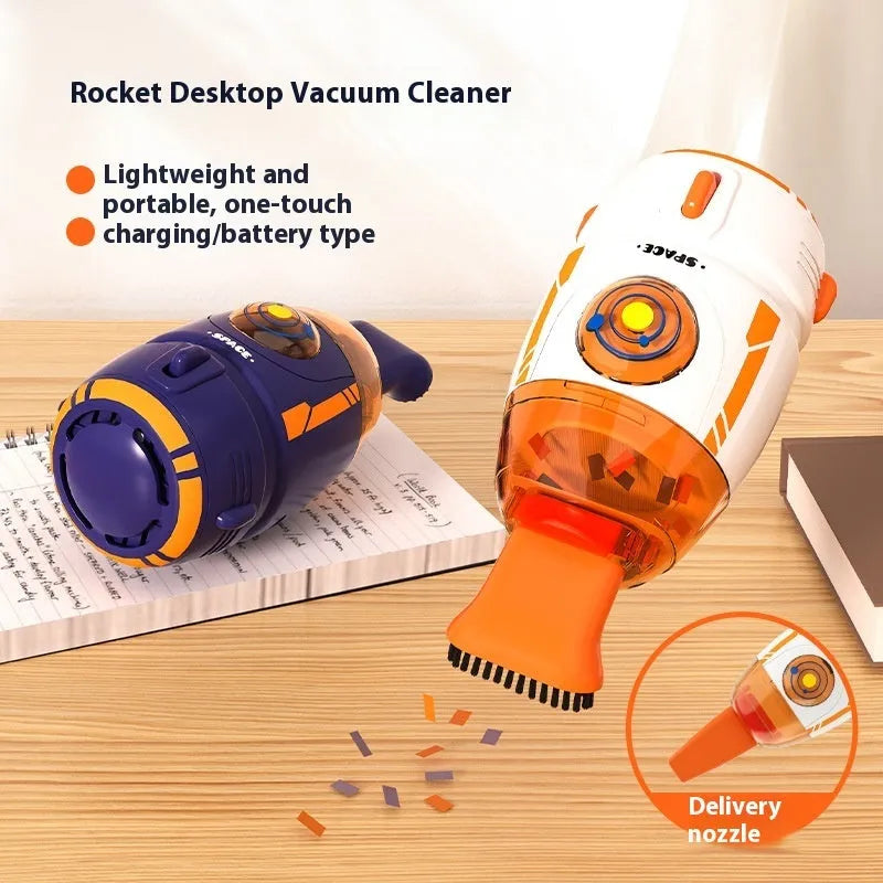 Blue handheld USB desktop vacuum cleaner on a wooden desk next to a keyboard