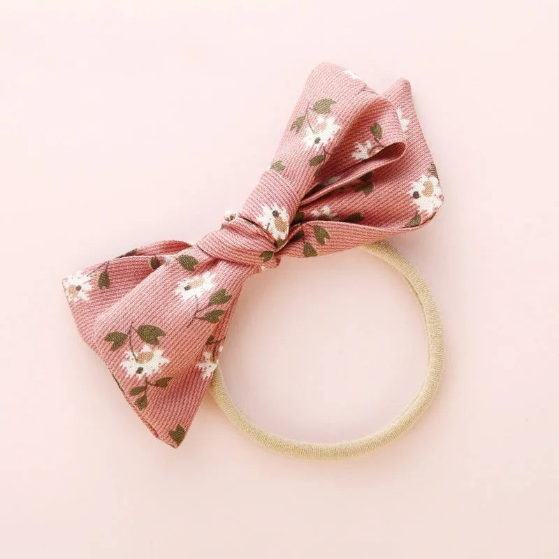 Children's knotted bow hair band in cloth fabric with six colour options
