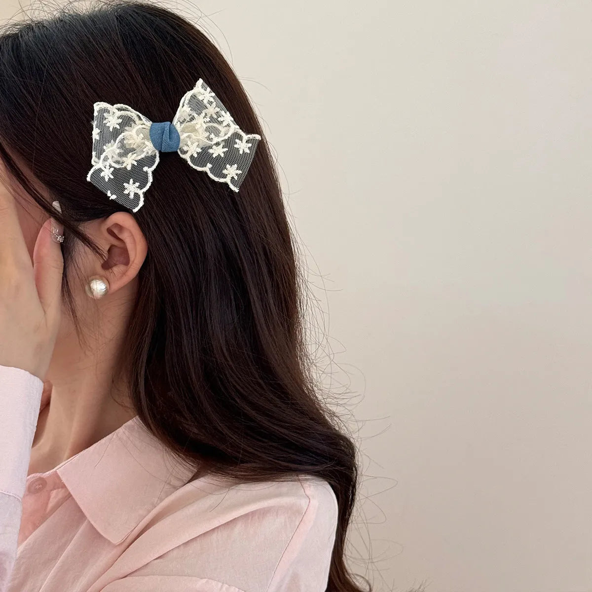 Beige lace hair rope barrette with blue bow decoration and metal clip