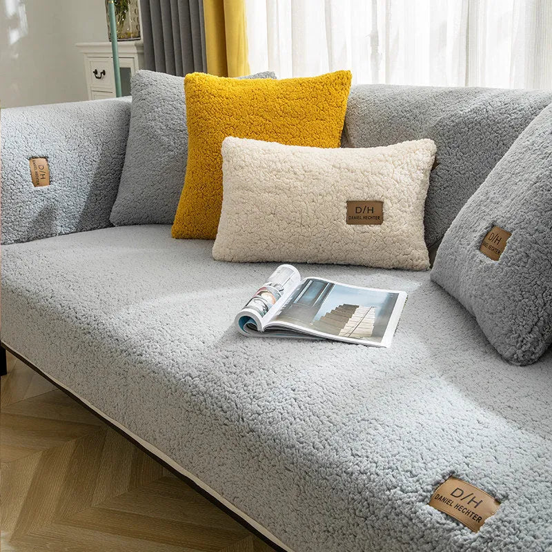 LELLEN beige plush sofa cover with anti-slip silicon rubber backing on a modern grey sofa