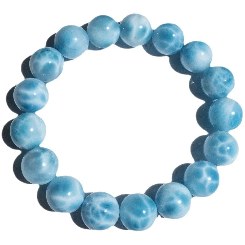 Blue manually crafted Bodhi bracelet with sea-pattern crystal stones and pearl details.