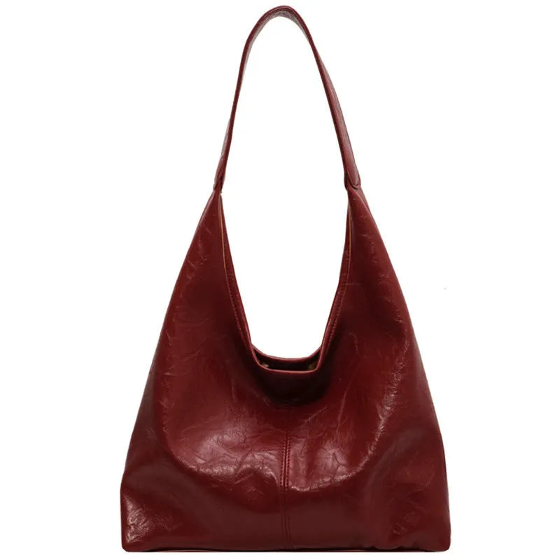 Casual soft PU leather large shoulder bag in street trend style with sandwich pockets.