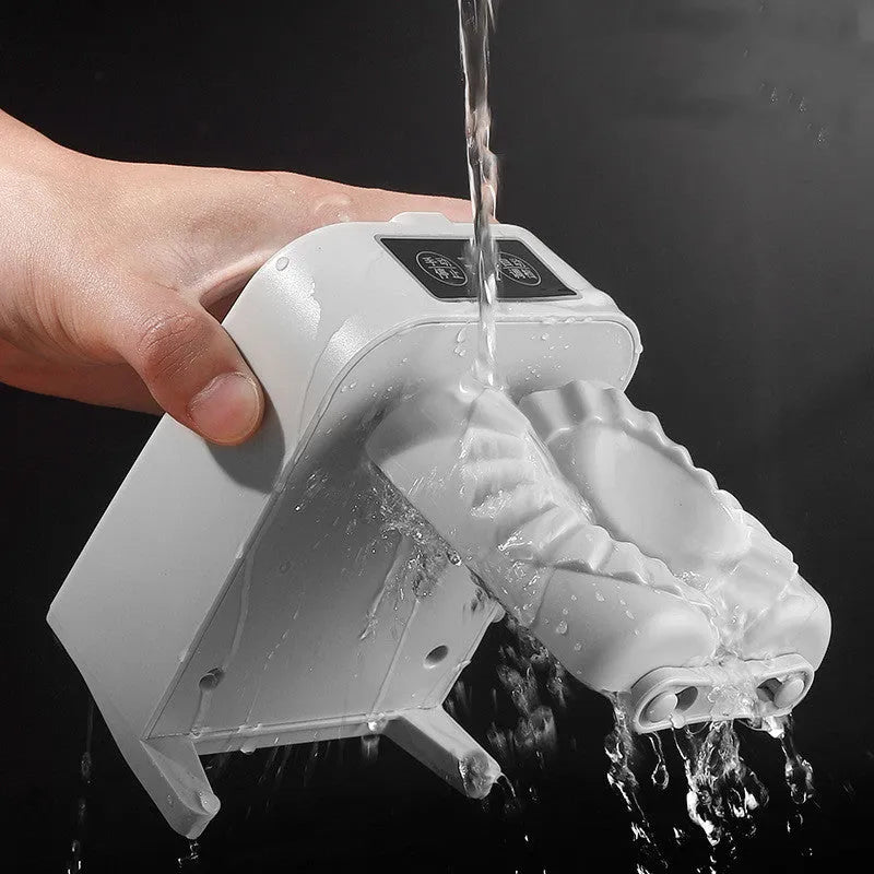 White automatic electric dumpling maker machine with USB charging cable on a kitchen counter