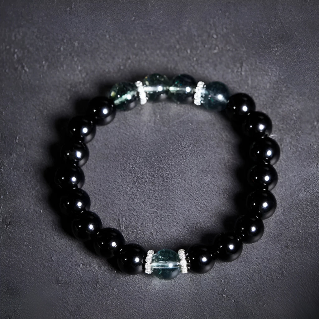 Chinese style black geometric bead bracelet with sterling silver components on wrist