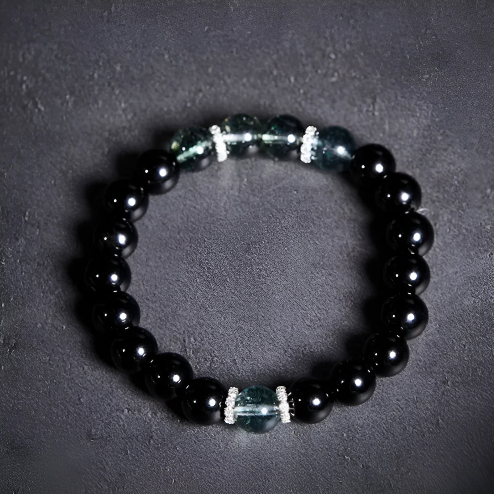 Chinese style black geometric bead bracelet with sterling silver components on wrist
