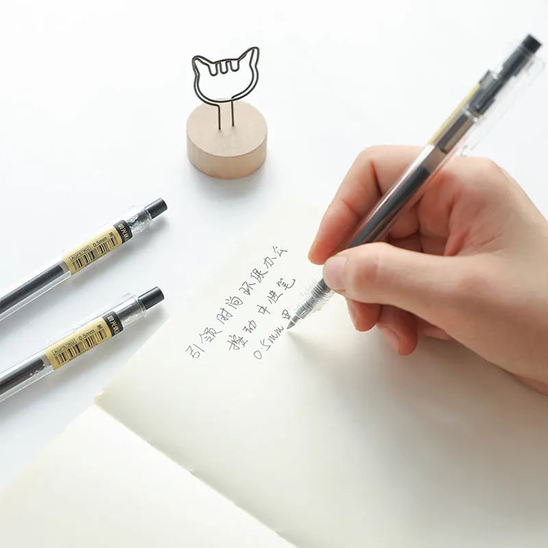 12 black retractable gel pens with frosted barrels and 2 refills on white background