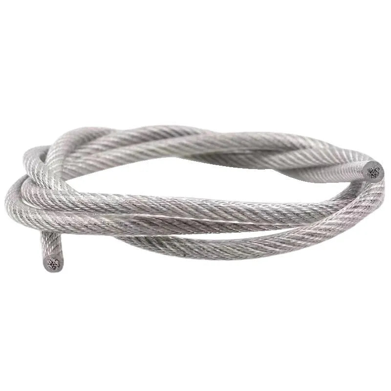 Close-up of a multi-strand 304 stainless steel anti-theft security cable coiled on a dark surface.