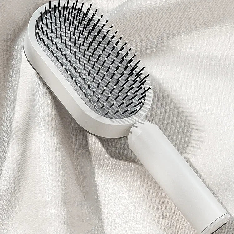 Self-cleaning hair brush with air cushion design and one-key cleaning function in various colour options