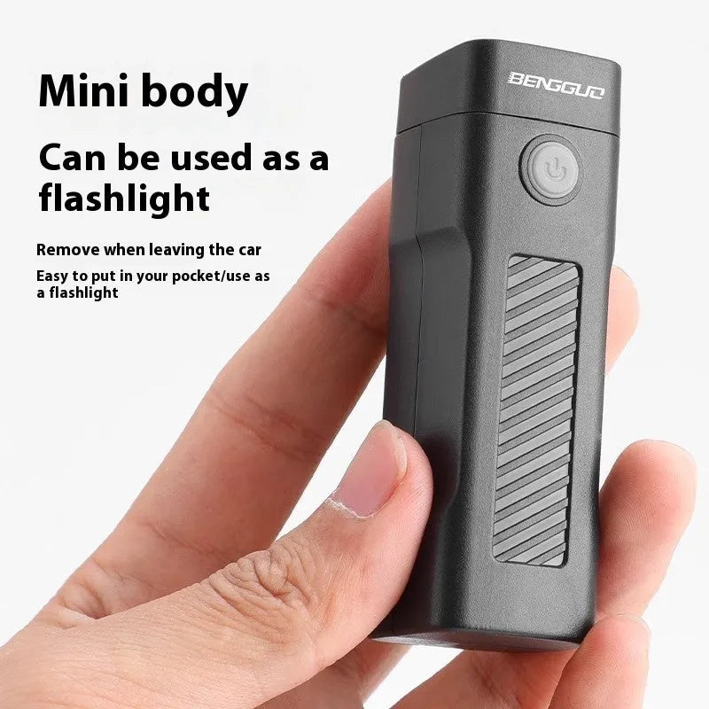 Black USB rechargeable bicycle headlight with quick-release strap mounted on bike handlebars.
