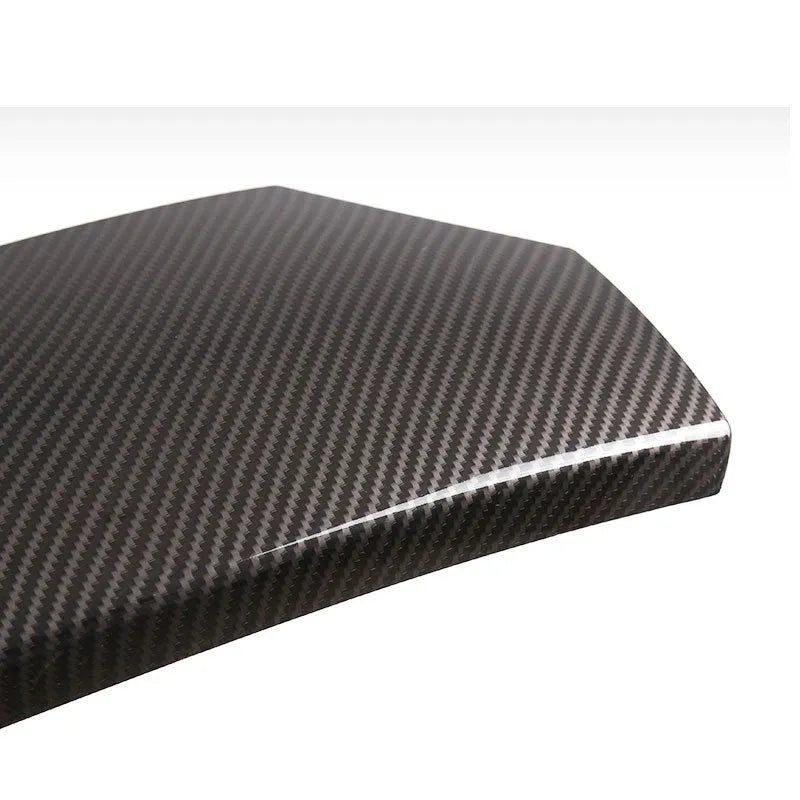Three ABS carbon fibre pattern armrest box protective covers showing diagonal weave texture