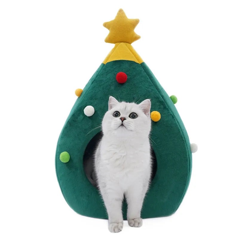 Red Christmas tree shaped cave pet bed with plush interior for a cat or small dog.