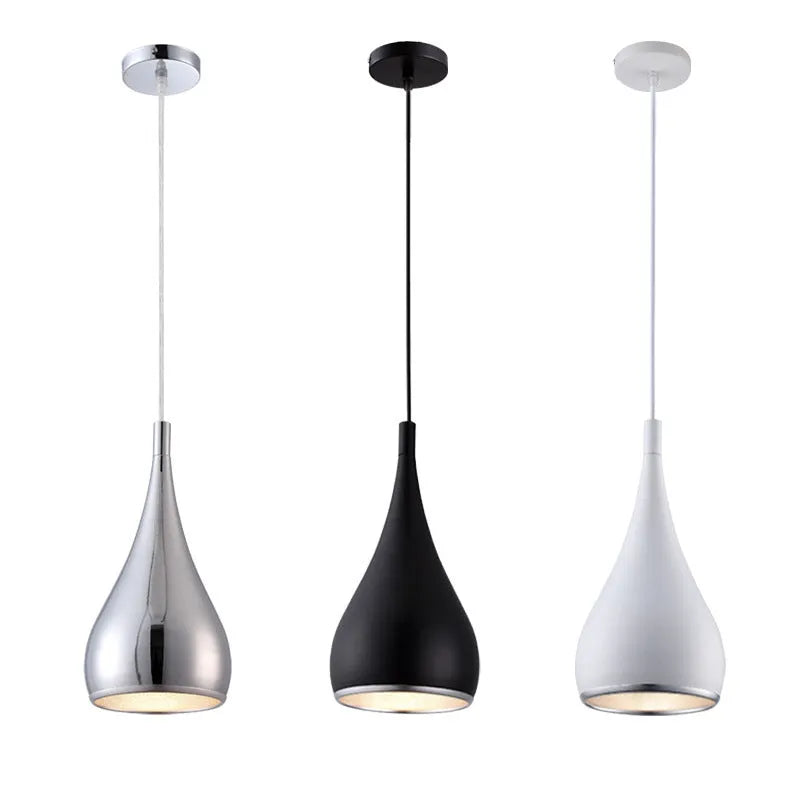 Minimalist iron pendant chandelier with three adjustable heads in a black finish, hung from a ceiling.