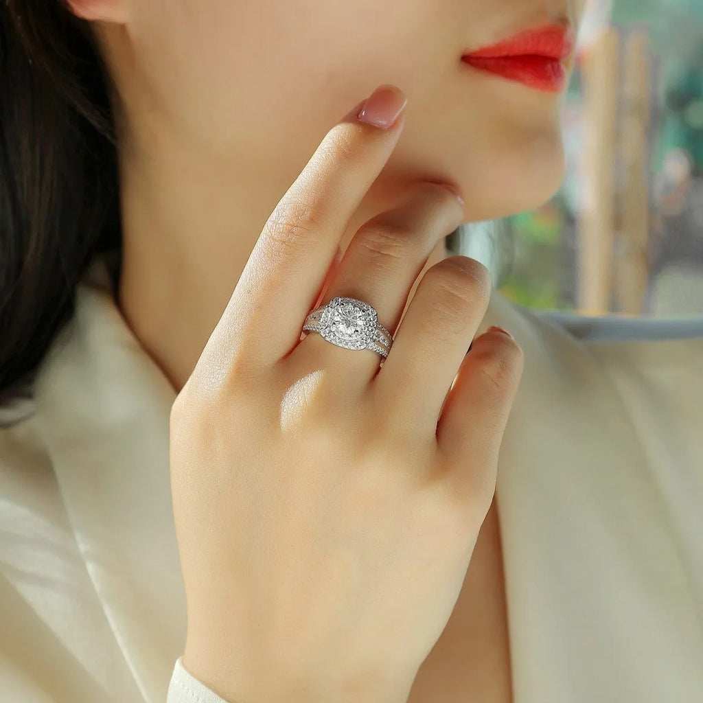 Moissanite silver ring with round cut geometric design on a silver band