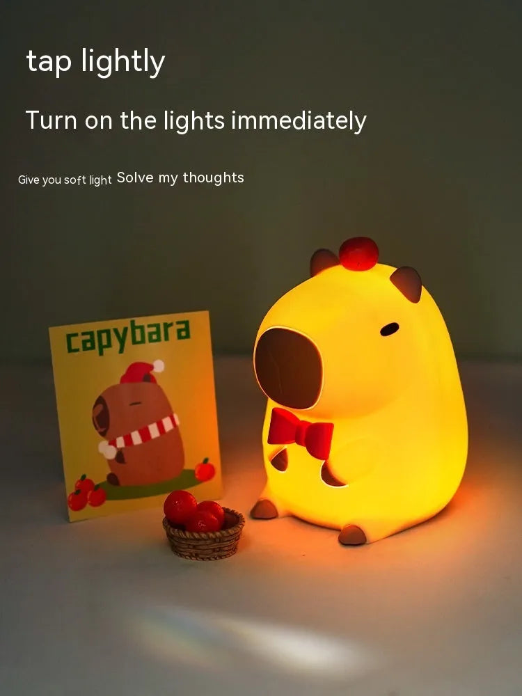 Capybara-shaped silicone night lamp with USB charging port and compact dimensions