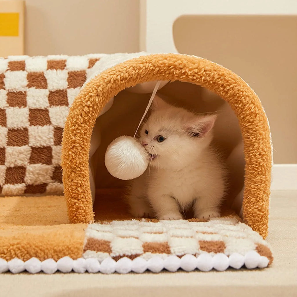 Coffee coloured plush fan-shaped pet bed with integrated tunnel for cats and dogs, showing thick mat and anti-slip base.