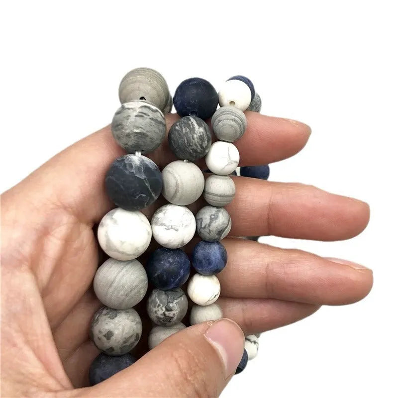 Handmade men's planet stone bracelet with starry sky beads in a U-shaped design.