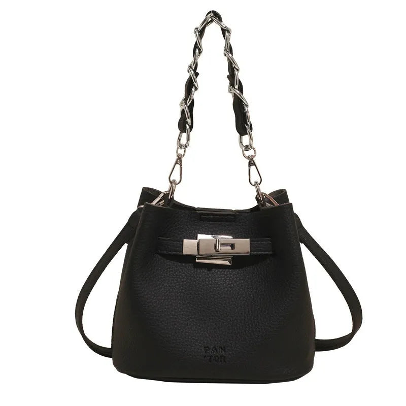 Soft PU leather retro bucket shoulder bag in black showing internal organiser pockets.